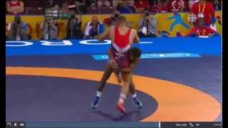 Cuban wrestler smilling just before throwing down the American - Gold Medal