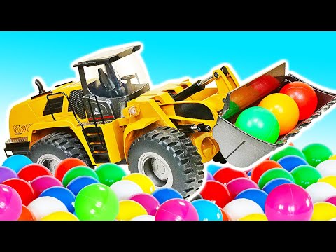 🚧🎨 ¡La excavadora llena la piscina con pelotas de colores!