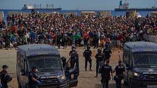 YouTube video thumbnail: Clashes in Spain's Ceuta Month After Mass Migrant Influx, Residents Try to Block Red Cross Aid