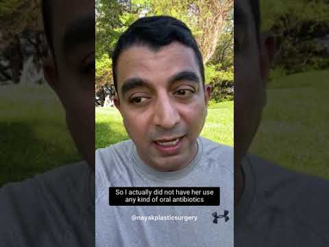 Doctor discussing antibiotic usage outdoors.