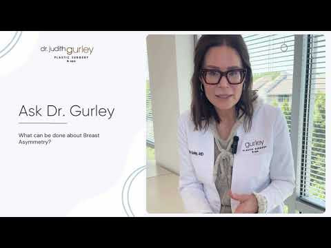 Doctor discussing breast asymmetry solutions.