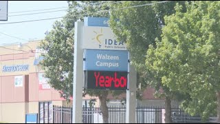 Local businesses lose revenue as parents use parking lots for school pickups