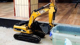I drove the excavator into the water basin so the frog could climb up and roar at the car.