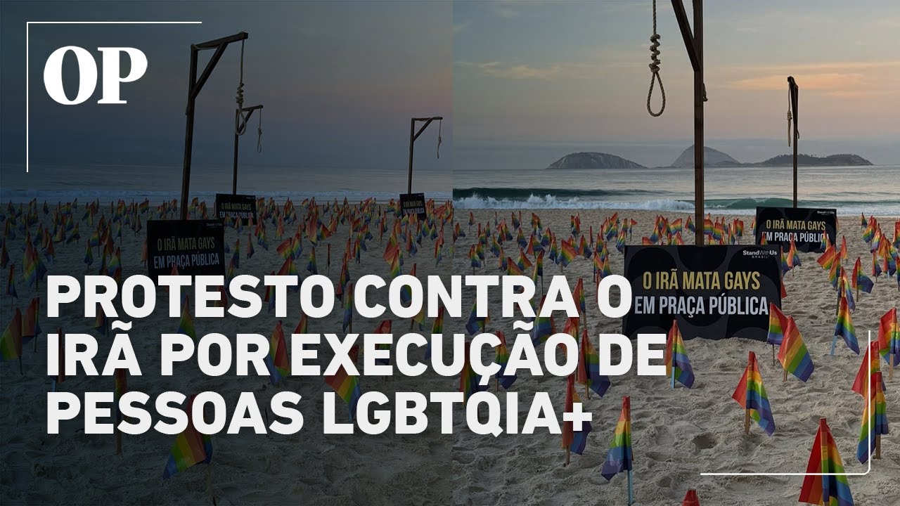 ONG faz protesto contra Irã na Praia de Ipanema, no Rio, utilizando forcas e bandeiras LGBTQIA+