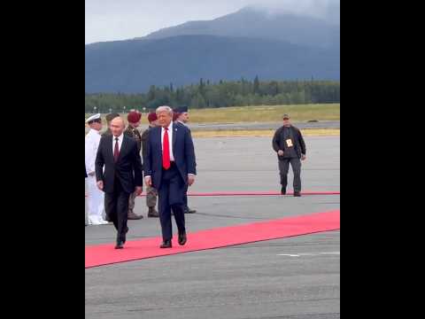 Trump and Putin shake hands as leaders head to closed-door meeting