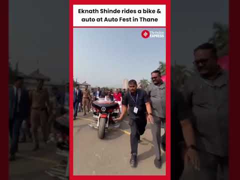 Maharashtra Deputy CM Eknath Shinde rides a bike and auto at Auto Fest in Thane