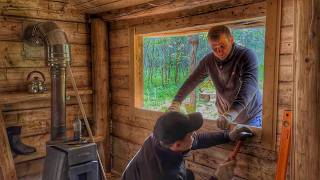Log cabin has become much more comfortable after installing a large window.