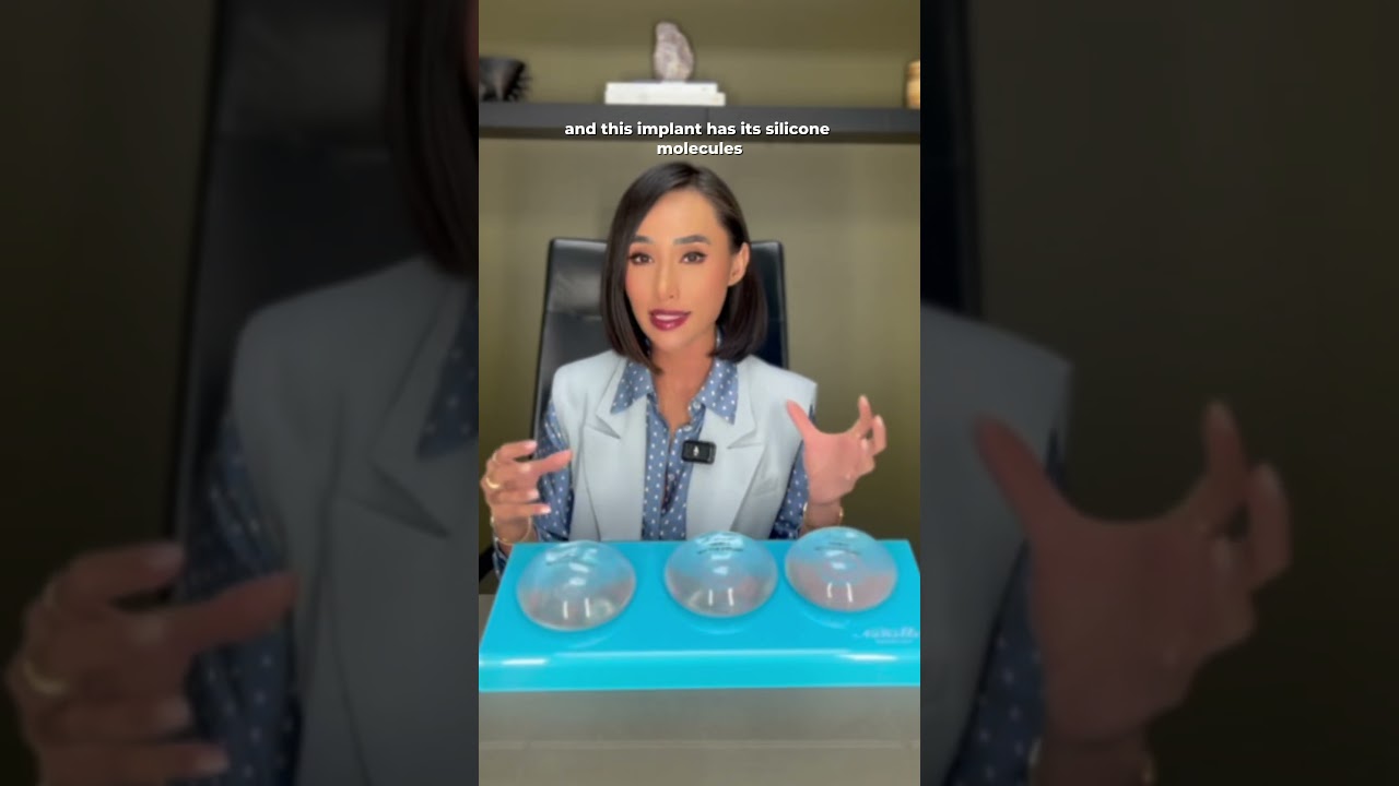 Doctor explaining silicone implants with demonstration.