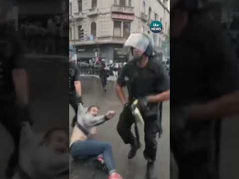 Pensioners and football fans clash with police in Argentina over austerity measures #itvnews