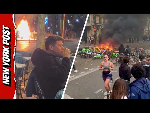 Unfazed Couple Enjoy Drinks as Violent Riots Rage Nearby in Paris