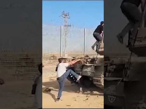 Gunfire heard as tank burns after Hamas attack