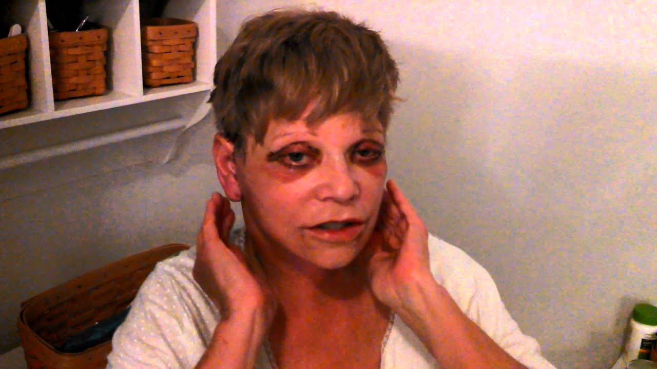 Woman with unusual makeup and expression.