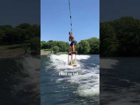 Riding 3ft tall surfboard on stilts. Wakesurfing stilt board world record!