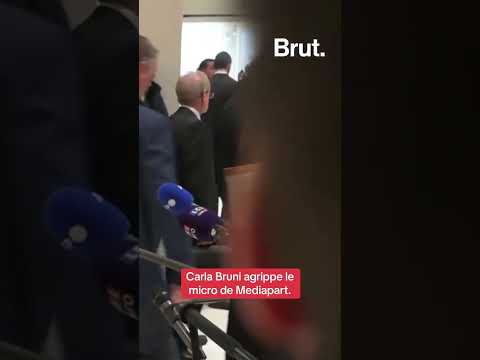 Carla Bruni agrippe le micro de Mediapart à l’issue de la prise de parole de Nicolas Sarkozy
