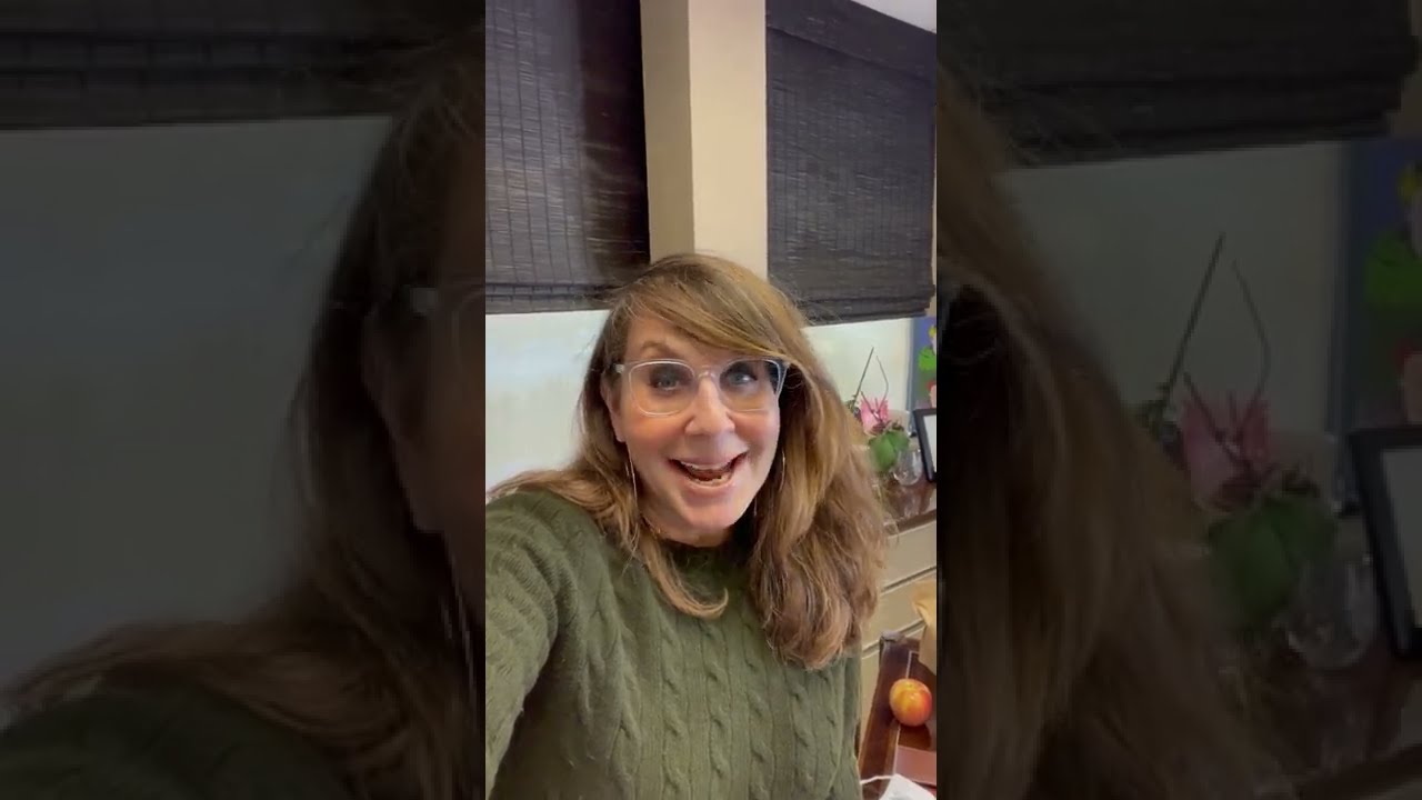 Woman speaking in an office setting.