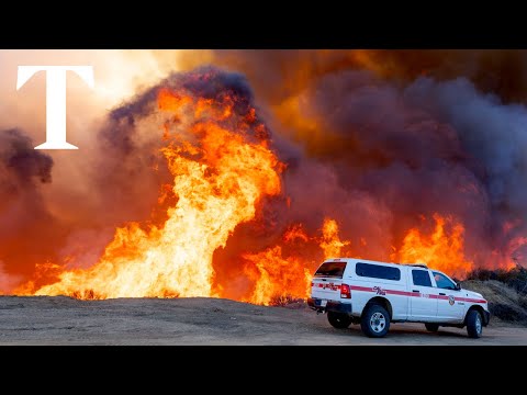 Wildfires burn through the night around Los Angeles