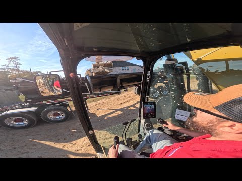 loading broken concrete onto end dump trailer (CAB VIEW)