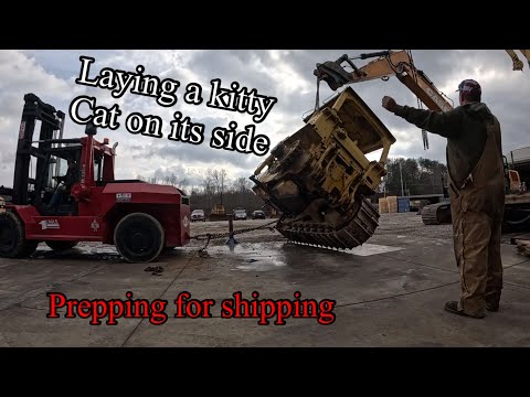 Dismantling two ex military Cat D7F dozers for a long ride across the ocean to Africa