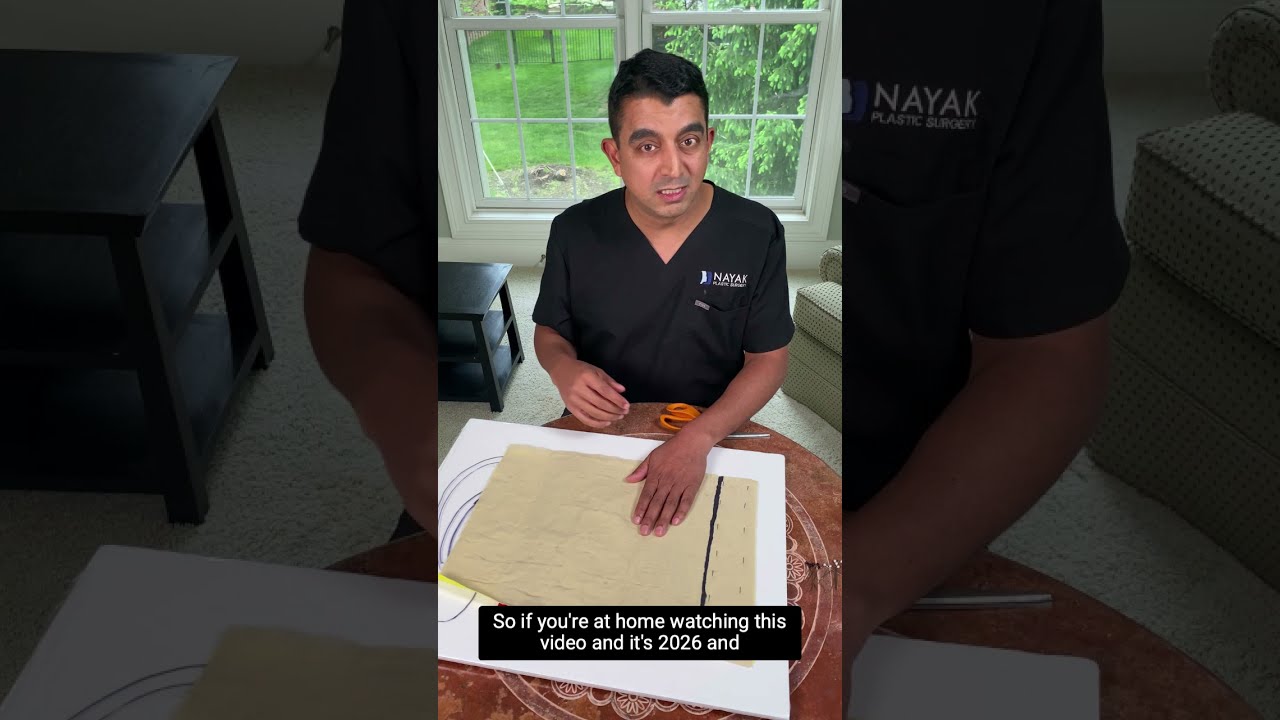 Doctor discussing a topic with scissors and paper.