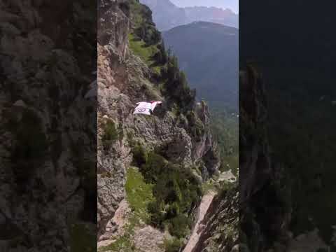 Daring Wingsuit Flight between Two Mountains