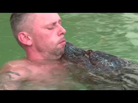 YouTube video thumbnail: Meet the German who Cuddles With his pet Alligator 