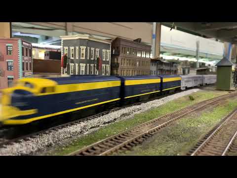 HO Scale Santa Fe EMD F7 A-B-B Set pulling FEC passenger cars.