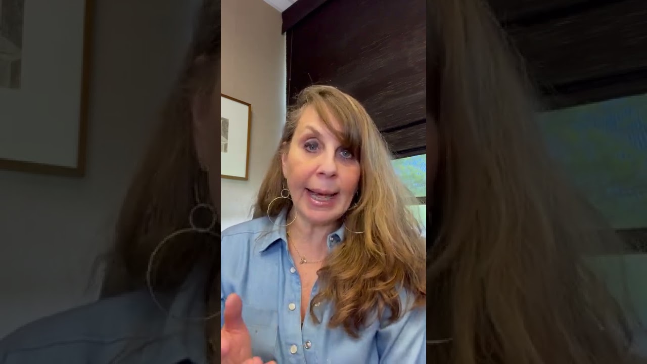 Woman speaking with a casual background setting.