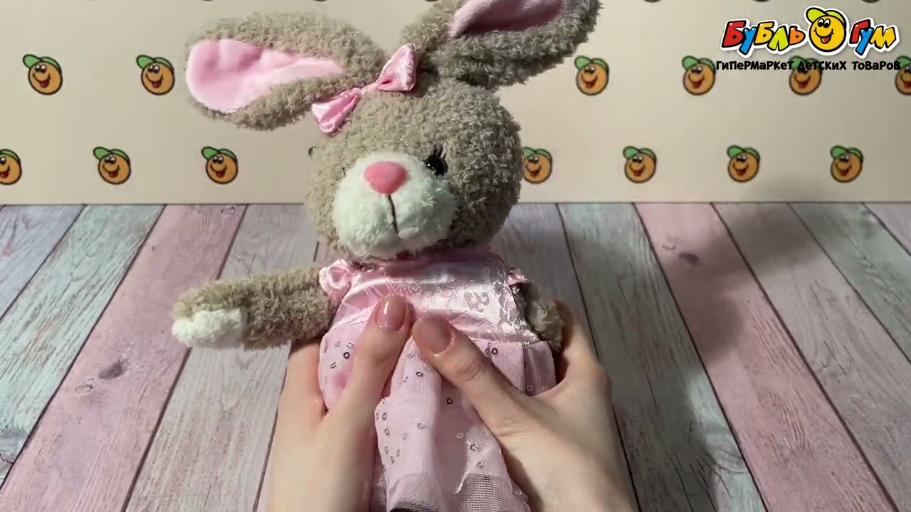 Игрушка мягкая Заяц в розовом платье - видео