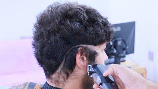 Watch how a man who hasn't had a haircut for a year gets his hair cut