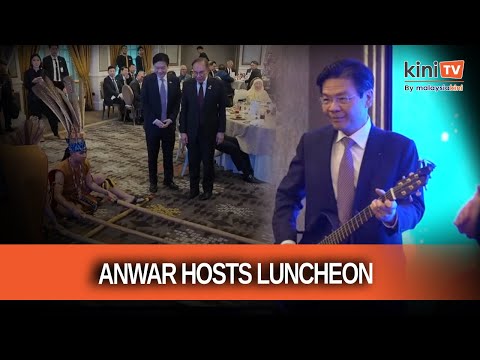 Singapore PM plays guitar, Anwar tries out bamboo dance