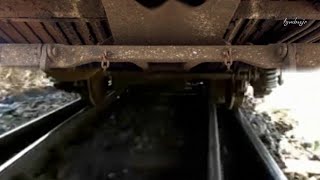 How do train wheels deal with railroad tracks