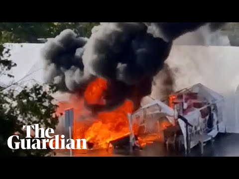 YouTube video thumbnail: Protesters' Tents on Fire After Shots Reportedly Fired Outside Serbian Parliament