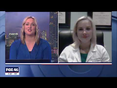 News interview with two women on screen.