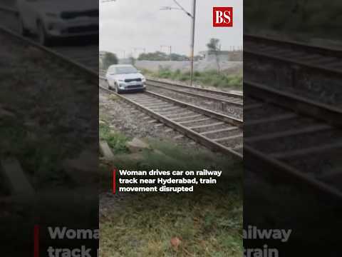 Viral video: Woman drives car on railway track near Hyderabad, train movement disrupted #shorts