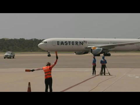 Flight from US with migrants arrives at Caracas airport | AFP