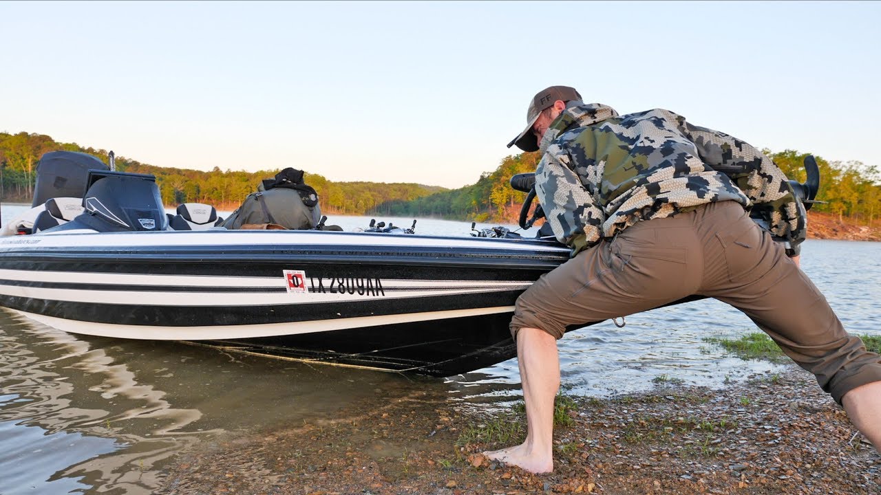 MY BASS BOAT IS STUCK! LAKE WATER DROPPED OVERNIGHT.