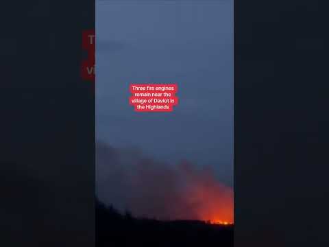 Six fire engines remain near the village of Divot in the highlands after a fire broke out