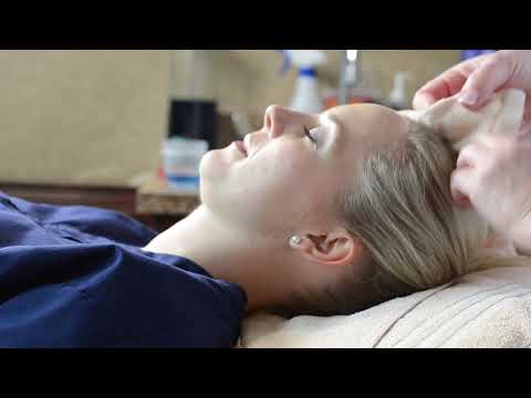 Woman receiving a relaxing spa treatment.
