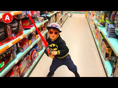 Superhero Adam Having Fun in Médiacité Shopping Center and Playing with Toys in Toy Store