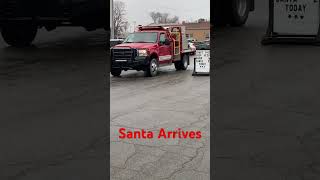 Santa Arrives to Greet Children in a Small Town