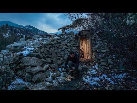 Repairing a stone shelter in the wilderness, alone off the grid, no talking