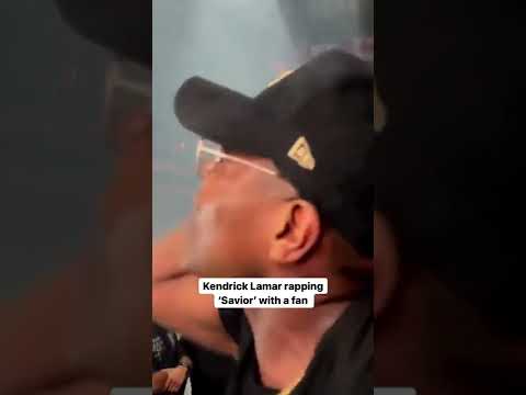 Kendrick Lamar rapping “Savior” with a fan