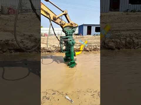 In a farm irrigation canal an excavator adjusts a hydraulic slurry pump #jcbpump