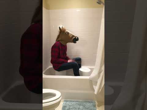 Man-horse plays "Paranoid" by Black Sabbath on a bucket in the bathtub