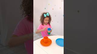 Rhia learns colours with plates and cups