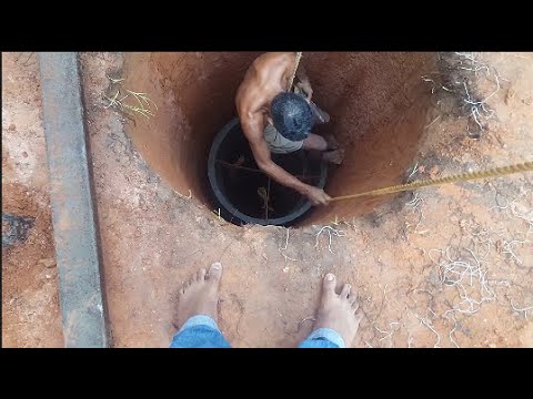 "Hand-Digging a Well and Constructing a Rainwater Tank: A Step-by-Step Guide"