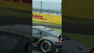 On a live racetrack with WEC cars in a bus