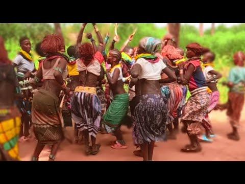 womans are happy during the bull jumping ceremony