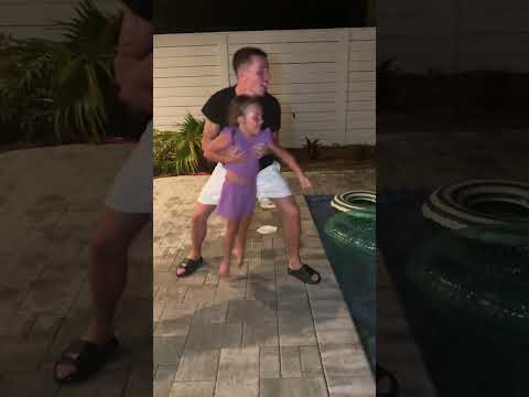 Dad throws girls in pool then this happens #shorts