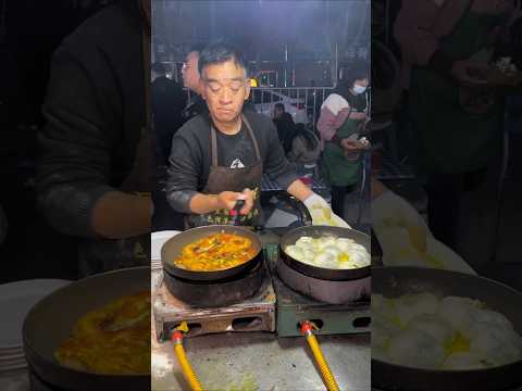 Chinese street food stall: The pot stickers made by the veteran chef look absolutely mouthwatering!